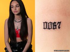 a woman with a tattoo on her arm and the word dory written in black ink