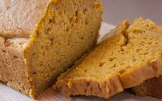 sliced loaf of pumpkin bread sitting on top of a cutting board