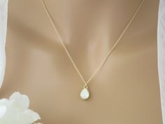 Complete your look with this simple petite Swarovski teardrop necklace. Beautiful in either White Opal or Black. Pendant measures 0.5 inches in length. Also available in sterling silver. Necklace lengths: 16 inches + a 2 inch extender 18 inches + a 2 inch extender Items arrive in a beautiful hand decorated gift box. Ready to ship in 3-5 business days. Simple Wedding Necklace, Wedding Necklace Simple, Black Crystal Necklace, Blue Bridal Earrings, Wedding Jewelry For Bride, Wedding Pendant, Pearl Jewelry Sets, Grand Rapids Mi, Teardrop Necklace