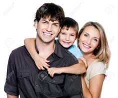 a man and woman with two children posing for the camera, one is holding his arm around the other's shoulders