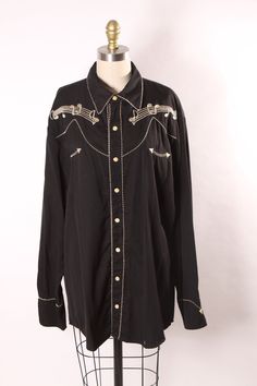 1990s Y2K 2000s Black and Gold Novelty Music Note Embroidered Long Sleeve Western Pearl Snap Shirt This shirt features: *Black base color *Long sleeved *Pearl snap closures *Gold embroidered music notes on front and back of shirt  *One of the XXL shirts has had extra side panels added in at the side of the waist making this a bit larger than the regular XXL provided in the other listing, these were used for a stage production in the 2000s. Please select which option you would like at checkout 😀 Western Style Black Button-up Shirt, Black Western Button-up Shirt, Western Pearl Snap, Pearl Snap Shirt, Western Style Snap Button-up Shirt, Stage Production, Western Snap Button-up Shirt, Y2k 2000s, Large Shirts