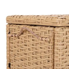 an empty wicker basket with rope handles