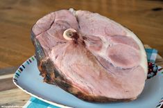 a piece of ham sitting on top of a plate