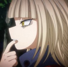 an anime character with blonde hair and blue eyes holding her finger up to her mouth