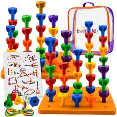 an assortment of colorful plastic pegs and a bag with the word twizzle on it