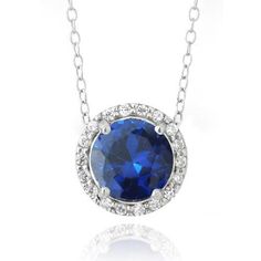 This stunning pendant shimmers with CZ stones. A single round created blue sapphire is bordered by sparkling CZ chips. This dazzling pendant dangles from an 18” rolo chain, and is crafted of fine sterling silver. Total gem weight: 2.25ct. Product Details Metal Type sterling-silver Metal Stamp 925-sterling Weight 2.8GR Length 18IN Width 11.1MM Height 11.1MM Clasp Type spring-ring Chain Type rolo Chain Length 18 Stone Details Gem Type created-sapphire Number of Stones 1 Stone Color blue Stone Shap Swiss Blue Topaz Necklace, Sapphire Necklace Pendants, Blue Topaz Necklace, Topaz Necklace, Anniversary Jewelry, Solitaire Necklaces, Sapphire Pendant, Flower Pendant Necklace, Necklace White