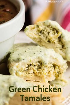 green chicken tamales on a white plate with a cup of soup in the background