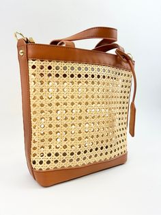 Stylish and perfect for the season, this woven rattan bag is the cutest accessory for all your summer outings! Product Details Material: Vegan Leather & Rattan Size: 10"L x11"W 5" Handle Drop Comes with side hooks to attach a longer shoulder strap One crossbody strap included Baby Keepsakes, Rattan Bag, Sorority Gifts, Woven Rattan, St Barth, Clutch Wallet, Accessories Necklace, Crossbody Strap, Accessories Bracelets