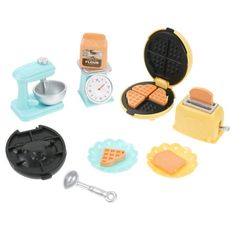 a toy kitchen set is shown on a white background, including a waffle maker and toaster