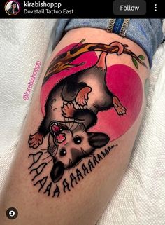 a woman with a tattoo on her leg that has an image of a rat and a tree branch