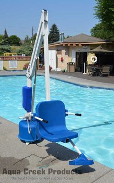 a blue chair sitting in the middle of a swimming pool