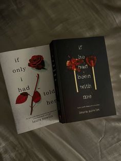 two books sitting on top of a bed next to each other