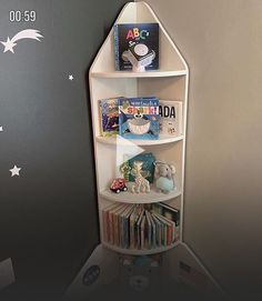 a book shelf in the corner of a child's room