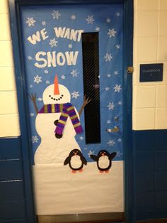 a door decorated to look like a snowman and penguin with the words we want snow written on it