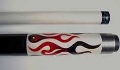 two white and black pens with red flames on the top one is black, while the other is white