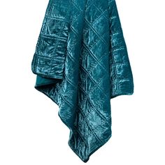 a teal green blanket hanging on a clothes line with an open jacket over it