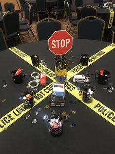 a table with police tape on it that says stop