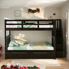 a bunk bed with two sets of drawers underneath it and christmas decorations on the wall