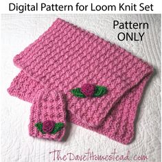 a pink knitted scarf and matching pair of fingerless gloves with flowers on them