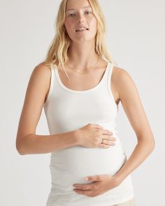 Our Bamboo Rib Tanks are a must-have for your pregnancy and postpartum wardrobe. Made from a blend of soft and breathable rayon from bamboo and organic cotton, these stretchy tanks provide ultimate comfort for pregnancy and beyond. The pack includes two tanks in versatile colors that can be worn alone or layered under your favorite outfit for extra comfort and support.  | Quince | Women's Bamboo Rib Maternity & Postpartum Tank Top 2-Pack in Egret/Blue Fusion, Size Small Postpartum Wardrobe, Organic Cotton Fabric, The Pack, Postpartum, Quince, 2 Pack, Favorite Outfit, Organic Cotton, Cotton Fabric