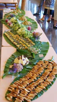 a long table filled with lots of food on top of it's sidelines