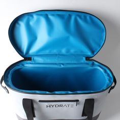 an open white and blue cooler bag with the lid closed to show it's inner compartment