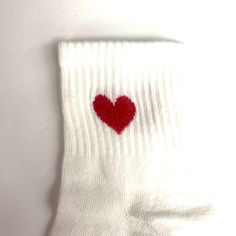 Ankle socks adorned with red hearts at the cuff. Cotton/poly blend. One size fits most. Red Hearts, Guitar Strap, Ankle Socks, Both Sides, Red Heart, Crew Socks, Gift Card, Socks, Cuff