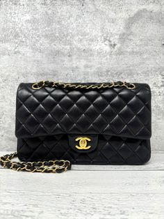 Designer: Chanel Model: Classic Double Flap  Condition: Good. Visible corner wear and scuffs. Minor creases and indentations on exterior. Faint hairline scratches on hardware. Minor scuffs and wear on the interior of bag. Measurements: 6 height x 10 width x 3 depth (inches) Exterior Material: Lambskin Exterior Color: Black Interior Material: Lambskin Interior Color: Burgundy Hardware Color: Gold Origins: Made in France 24 series Flap Shoulder Bag, Chanel Model, Bag Measurements, Interior Color, Chanel Black, Black Interior, New Bag, Colorful Interiors, Made In France