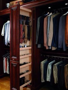 the closet is full of men's clothing and ties