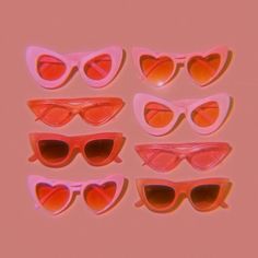 six pairs of pink heart shaped sunglasses on a pink background, with one pair in the shape of a cat's eye