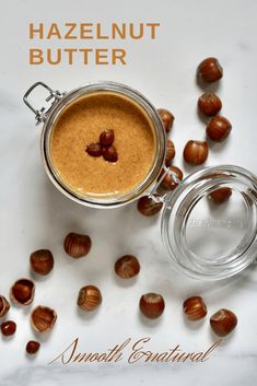 hazelnut butter in a glass jar surrounded by nuts