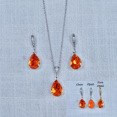 This beautiful handmade small and delicate teardrop dangle bridal earrings, necklace and bracelet feature Orange Tangerine European crystal pear shaped fancy stones in 3 finishes--Clear, Opal and Fire Opal. The small pear stones measure 10x14mm and are hand set in your choice of settings (rhodium (silvertone), yellow or rose gold). The earrings feature cz set french hooks, the necklace features a cz set bail and 18" 925 sterling silver chain and the bracelet features a lobster claw clasp with an Orange Crystal Jewelry, Nickel-free Dangle Teardrop Earrings For Wedding, Nickel-free Teardrop Dangle Earrings For Wedding, Sterling Silver Nickel Free Teardrop Earrings For Wedding, Nickel-free Drop Jewelry For Party, Crystal Teardrop Pendant Jewelry Sets As Gifts, Gift Crystal Teardrop Pendant Jewelry Sets, Elegant Nickel-free Drop Necklace, Formal Drop Jewelry Nickel Free