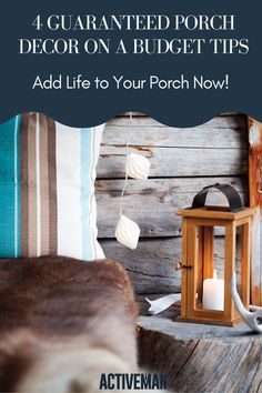 a wooden table topped with a lantern next to a wall covered in wood planks