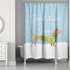 a shower curtain with a dachshund wearing a sweater on it's side