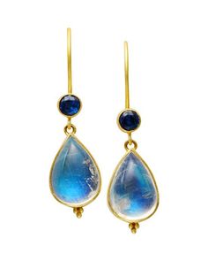 Inspired by the jewelry of the Etruscan era, these luminous earrings feature pear shaped blue moon stones suspended from brilliant blue bezel set Kyanite. The delicate granulation detail finishes off these classic drop earrings. Hand crafted in Bali of 18k yellow gold.