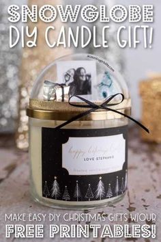 a candle that is sitting on a table with the words snowglbe diy candle gift