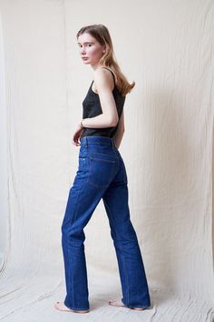 "High waist bootcut jeans in a dark blue wash. These jeans are a staple piece for any wardrobe, and look great with everything from blouses to sweaters. They feature a high waist, belt loops, front and back pockets and zipper fly.  In excellent condition.  The model is 5'7 and size 8 (UK). MEASUREMENTS Waist: 73.5 cm / 29\" Hips: 94 cm / 37\"  Thigh: 51 cm / 20\"  Rise: 29 cm / 11.5\" Inseam: 76 cm / 30\"  Length: 103 cm / 40.5\" MATERIAL: 100% Cotton FREE UK SHIPPING on orders over £100 - use the code LUCKYUK at checkout." Vintage High Waisted Jeans, Blue Bootcut Jeans, High Waisted Jeans Vintage, Dark Blue Jeans, Jeans Bootcut, High Waisted Jeans, High Rise Jeans, Staple Pieces, Vintage Denim