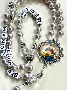 Welcome to my shop, Creating Still Moments Please visit my shop for other listings https://www.etsy.com/shop/CreatingStillMoments?ref=sh-carousel-1  Handmade  Personalized Mother Rosary | Handmade Rosary |Mary centerpiece Smoky Pearl bead Silver and White Pearl Bead accents Pardon crucifix Catholic mom gift CAtholic grandmother gift  Mother's Day gift Children or grandchildren's names may be added as substitute for decade beads. The names will be evenly dispersed amongst the five decades of the Rosary Mary, Catholic Kids Crafts, Catholic Kids Activities, Decades Of The Rosary, Handmade Rosary, Pearl Rosary, Rosary Prayer, Catholic Images, Catholic Kids