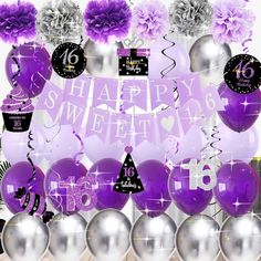 purple and silver balloons are arranged in front of a happy sweet sixteen sign with flowers