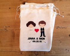 a drawstring bag with an image of a bride and groom holding a heart