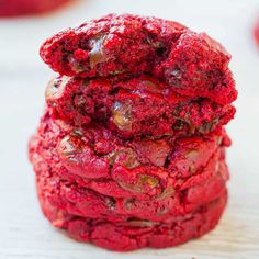 red velvet cranberry butter chocolate chip cookies stacked on top of eachother