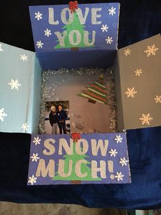 an open box that has some pictures in it and the words love you snow much