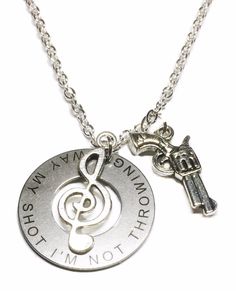 a silver necklace with a musical note and a key on the chain that says, i'm not going down this road