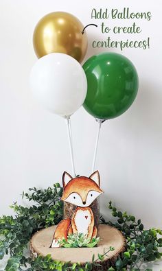 two balloons are on top of a tree stump with a fox figurine in the center