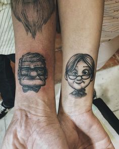 two people with matching tattoos on their arms