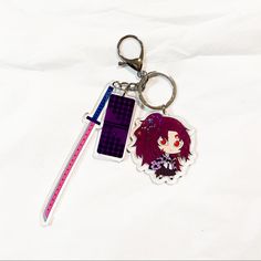 a keychain with an anime character on it and a ruler attached to it