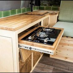 a stove top oven sitting inside of a kitchen