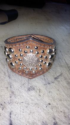 "This cuff is made from oil tanned buffalo leather to hold up to daily wear. my cuffs fit wrests from 8.5 inches up to 10 inches and custom sizes can by made contact me for pricing. The spots and concho are chromed. I line my cuffs with another layer of the buffalo leather so no metal touches the skin, so no worry's about allergy's to metals. all my products are handmade in the USA and have a 5 year limited warranty \"manufacture defect ." Leather Cuff Bracelet With Concho, Leather Concho Cuff Bracelet, Leather Punk Cuff Bracelet For Festival, Leather Cuff Bracelet With Rivets, Rustic Leather Concho Bracelets, Vintage Leather Bracelet With Rivets, Vintage Leather Bracelets With Rivets, Rustic Leather Bracelet For Festivals, Rustic Concho Cuff Bracelet For Festival