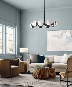 a living room with blue walls and furniture