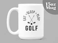 a white coffee mug that says eat sleep play golf